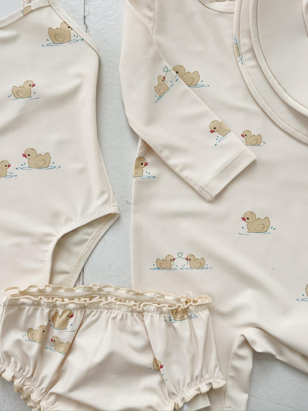 Konges Slojd Fanga Fontana Como Swim Onesie, Konges Slojd Fanga Fontana beebi ujumiskombe, UV-kombe, UV-kaitsega kombe