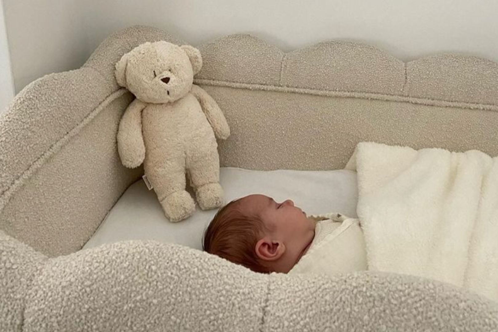 Moonie humming bear in baby bed